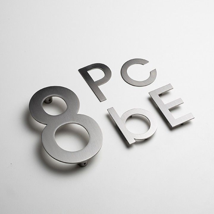 Lowercase alphabets with concealedfixing through strong adhesive