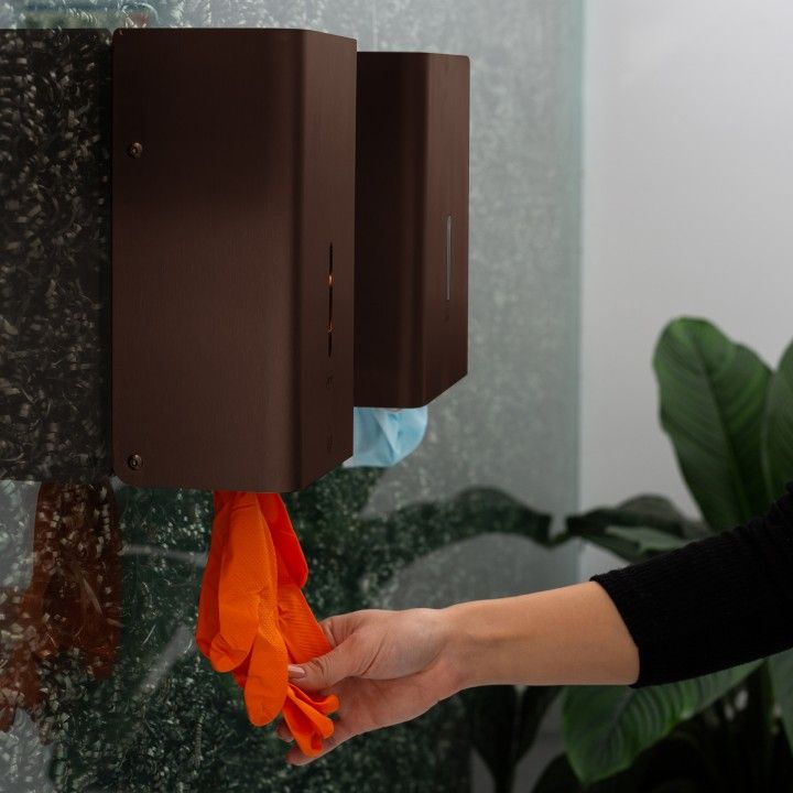 Wall dispenser for disposable rubber gloves